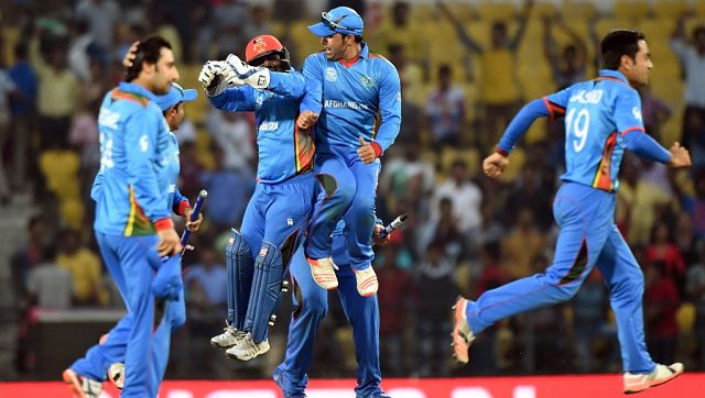 2016年3月27日，在那格浦尔的Vidarbha板球协会体育场，阿富汗球员在赢得对西印度群岛的世界卡塔尔世界杯4强赔率T20比赛后庆祝。法新社
